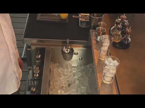 ScoopHolster Video Ice Scoop Holder attached to ice container sink in bar drinks mixed and ice scoop used